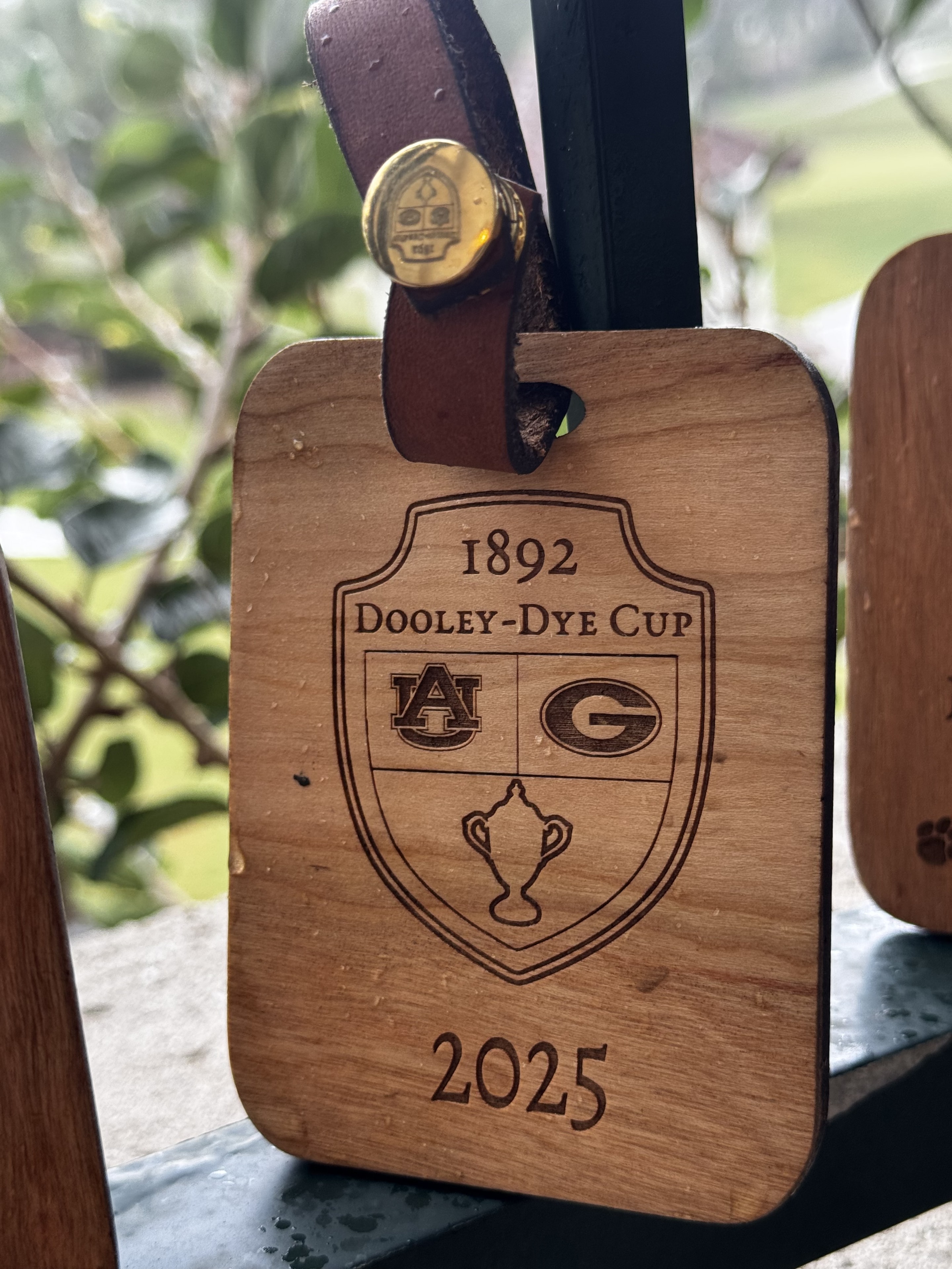 Engraved wooden Dooley-Dye Cup bag tag with shield crest, 2025