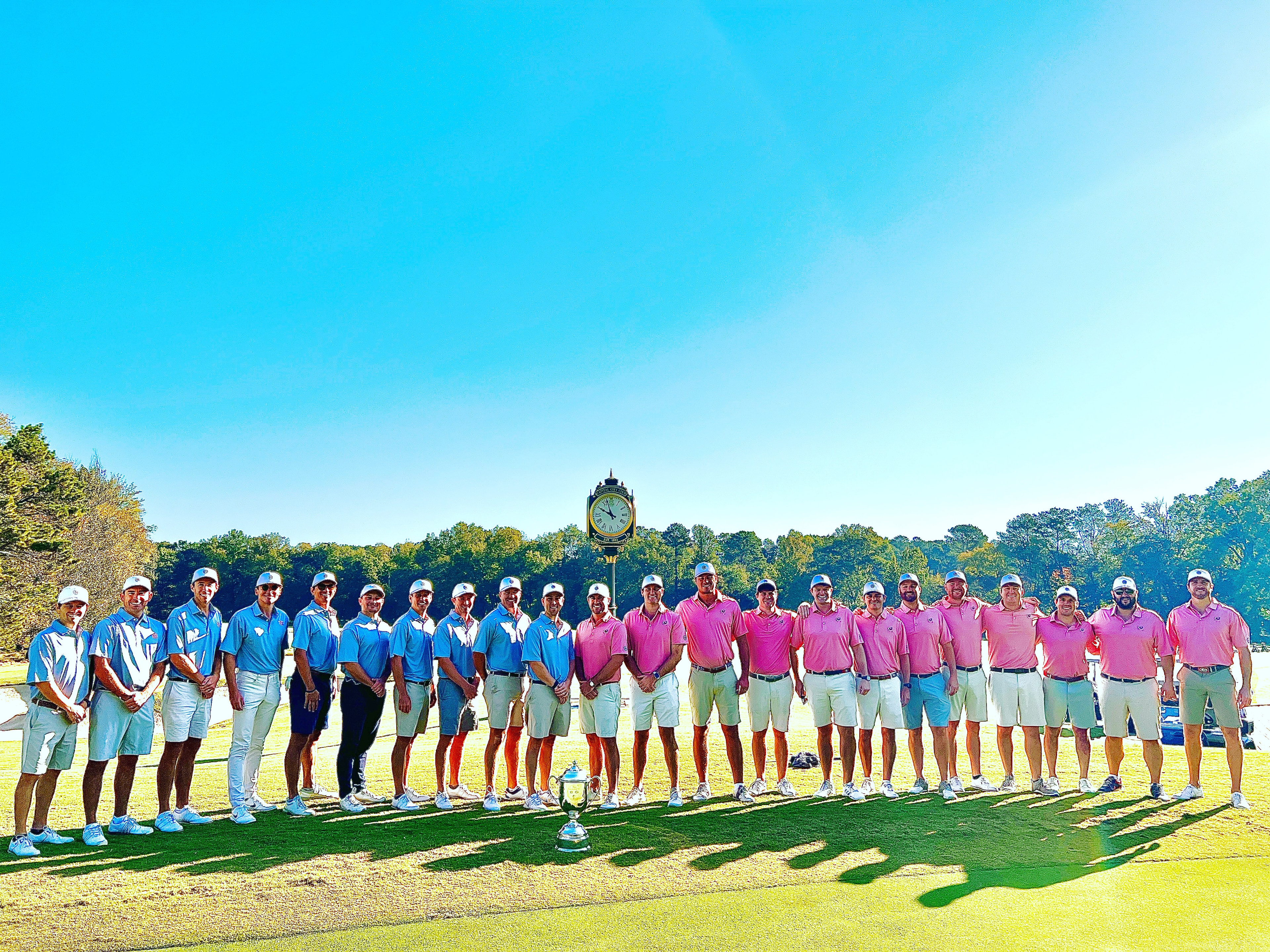 Both teams posing on the putting green