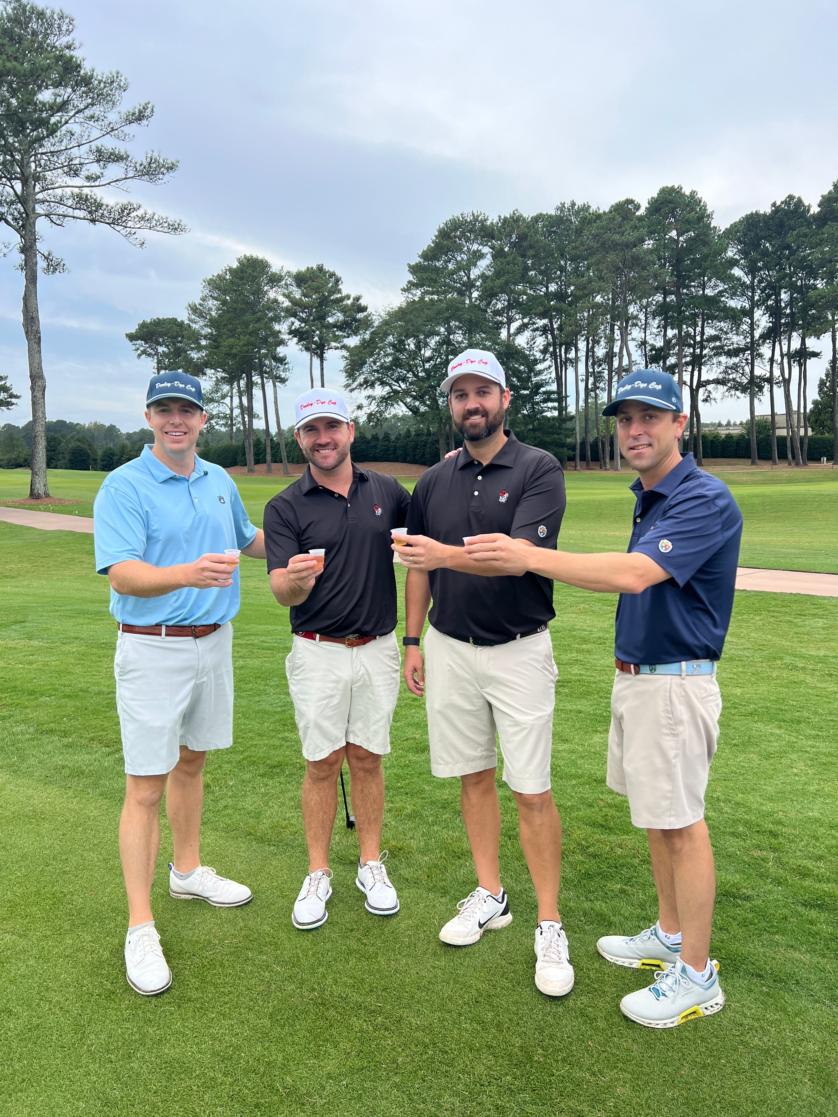 Foursome of players on the fairway at the Dooley-Dye Cup