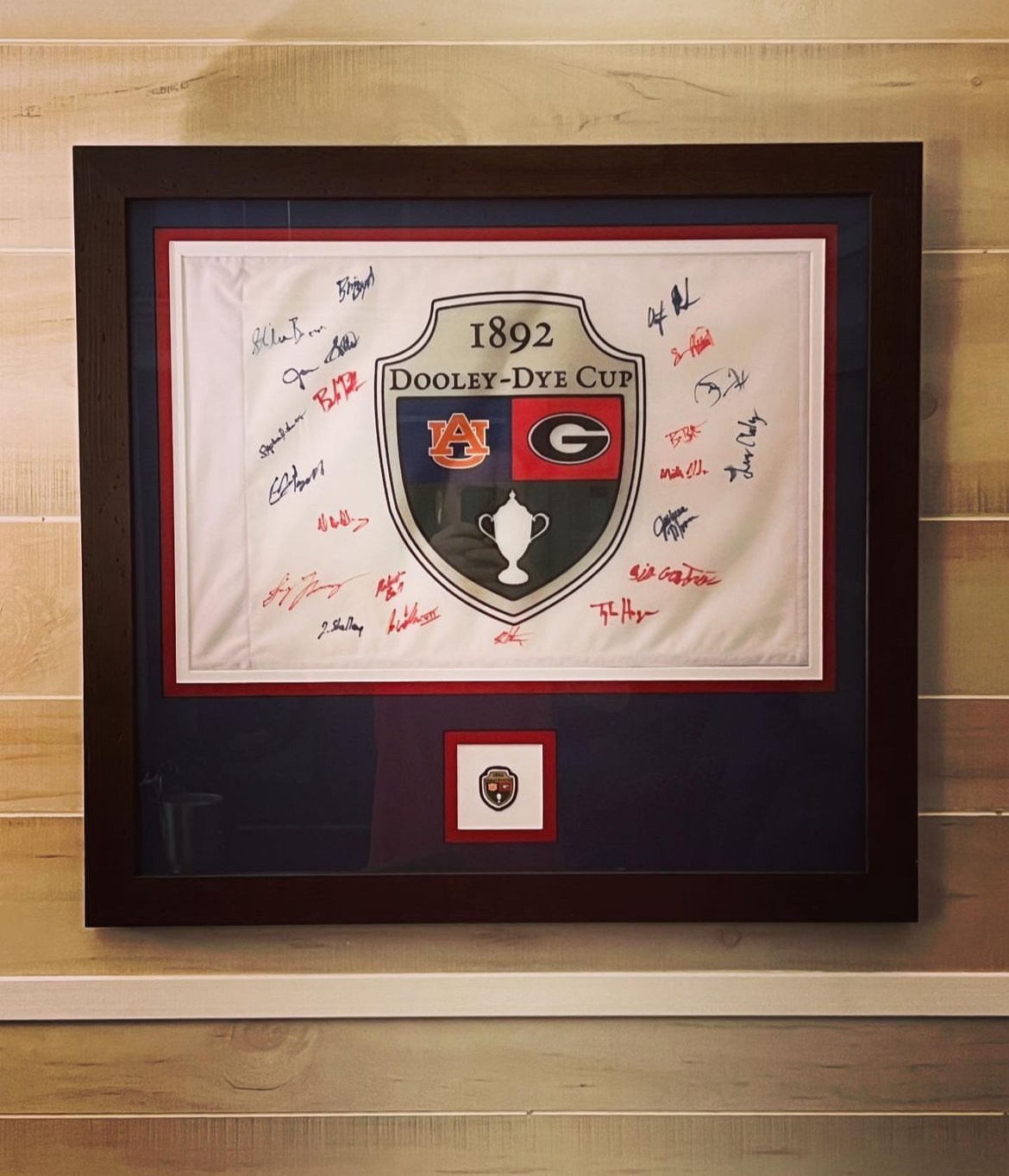 Framed signed Dooley-Dye Cup flag with all player signatures