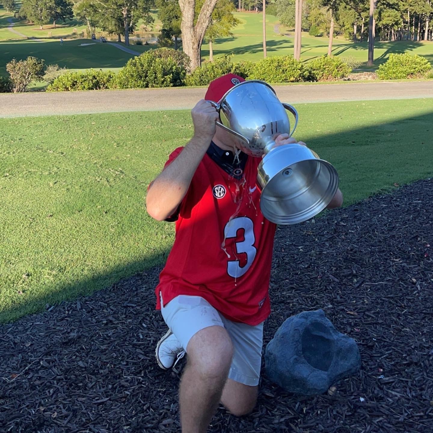 Player celebrating with the trophy