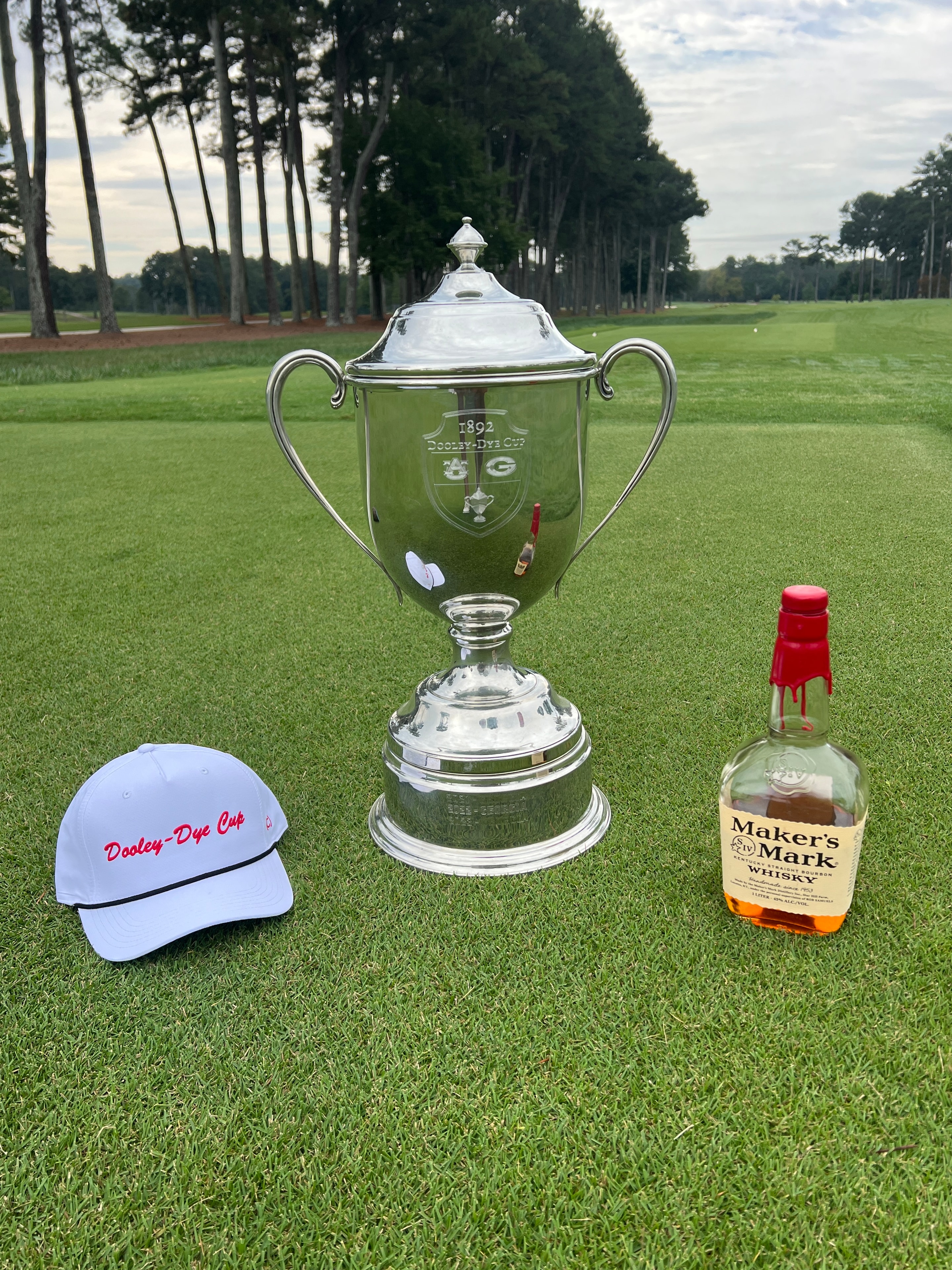 Dooley-Dye Cup trophy with Maker's Mark whisky on the green